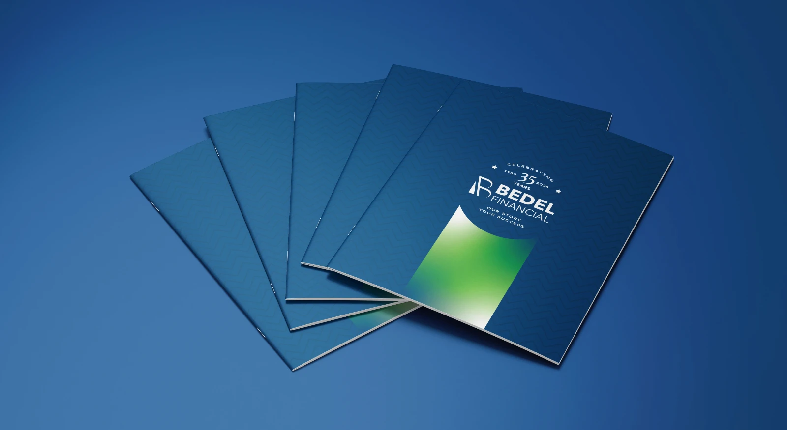 Copies of Bedel Financial’s 35-year anniversary magazine fanned out on a blue field.